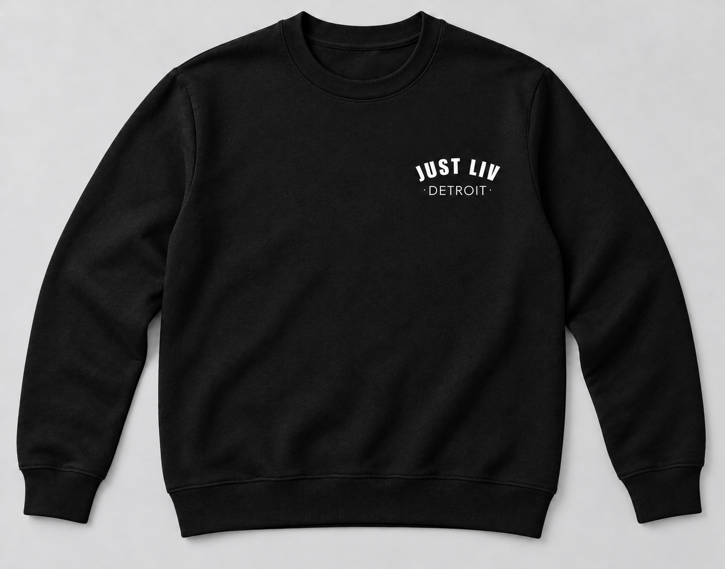 Black crewneck sweatshirt with a small white Just Liv Detroit logo on the left chest