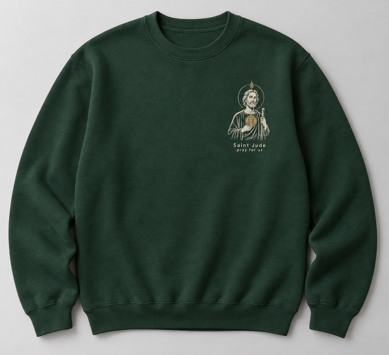 Forest-green concept crewneck sweatshirt with a small ivory and gold Saint Jude illustration and the words Saint Jude, pray for us